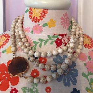 Multi strand bead necklace with faux stone.